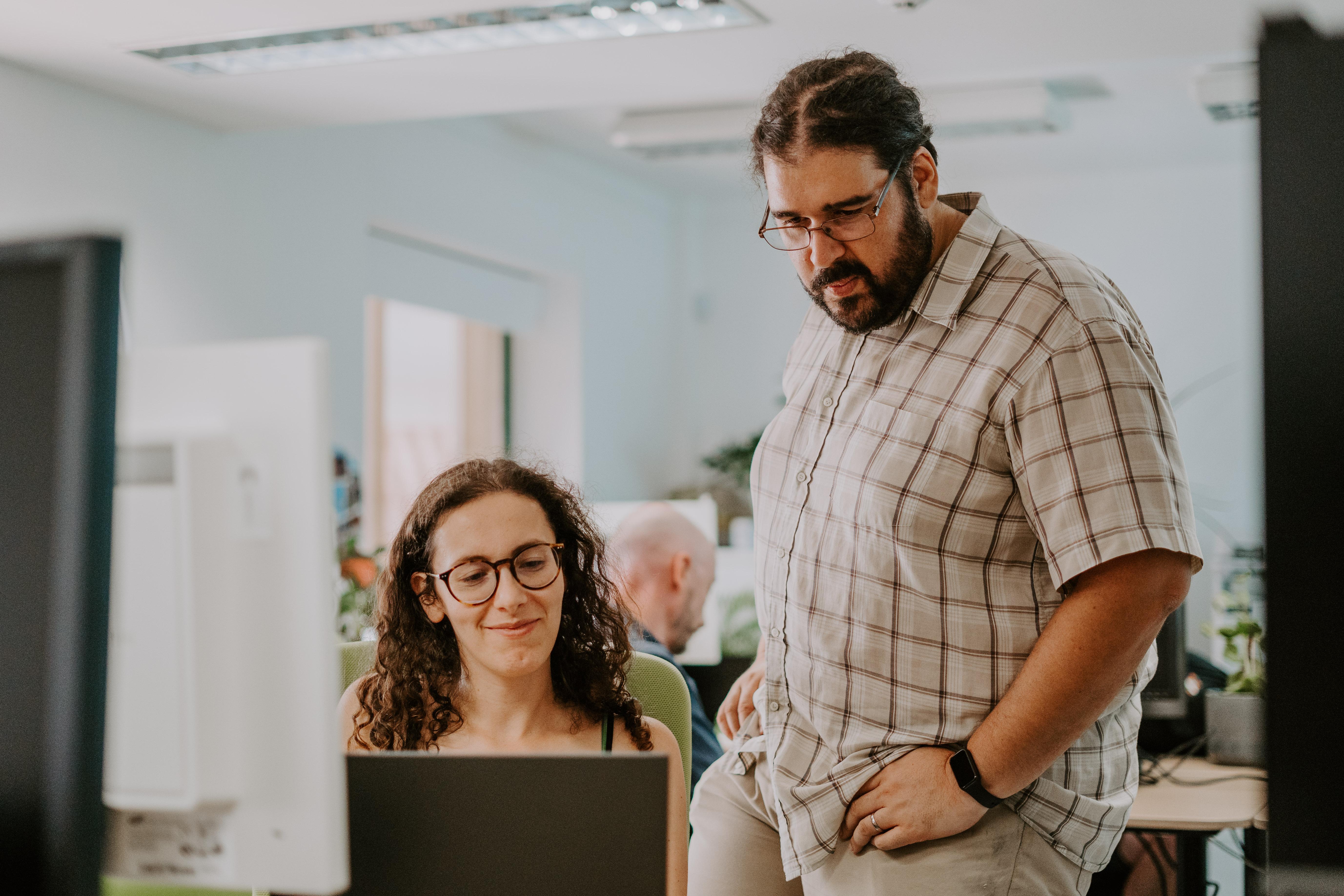 Startup founders collaborating in modern workspace